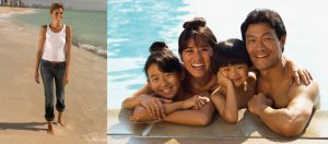 This image shows a woman walking alone in the sand along the shoreline. She is smiling and appears to be happy. Pictured on the right-hand side are four individuals huddled together closely in a pool. Included in this group is an adult female, an adult male, a female child and a male child.