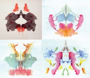 This image is divided into four equal quadrants; each quadrant displaying an ink blot image. The ink blot in the top left quadrant is the second inkblot card shown in brown and red. The inkblot in the top right quadrant is the eighth inkblot card shown in pink, orange, green and blue. The inkblot in the bottom left quadrant is the ninth inkblot card shown in yellow, orange, peach, and green. The inkblot in the bottom right quadrant is the tenth inkblot card shown in blue, yellow, green, red, gray, and orange.