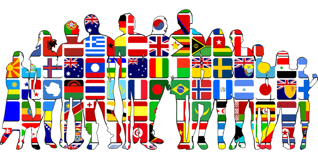 This photo shows a clip art image of twelve different human figures aligned horizontally. The inside of the figures feature various flags from several different countries.