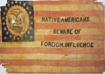 This is an image of a flag used by the Know Nothing Party. The flag is very similar to the American flag, but contains the words, “Native Americans. Beware of Foreign Influence”