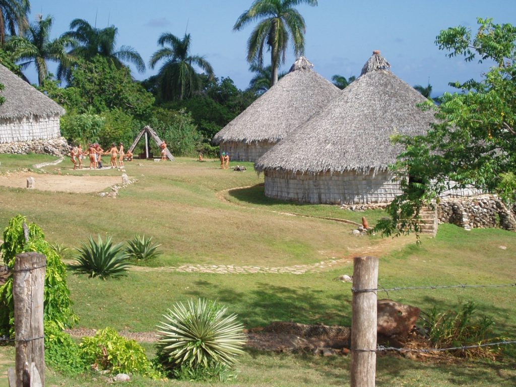 This reconstruction of a Taino village in Cuba, which features three dwellings and people dressed in traditional Taino clothing, is representative of what Christopher Columbus may have encountered when he first arrived in the Bahamas in the 1490s.