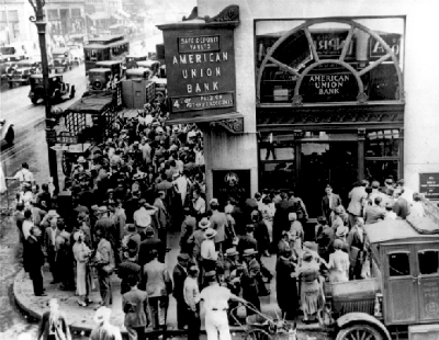 A crowd forms at New York’s American Union Bank during a bank run during the Great Depression.