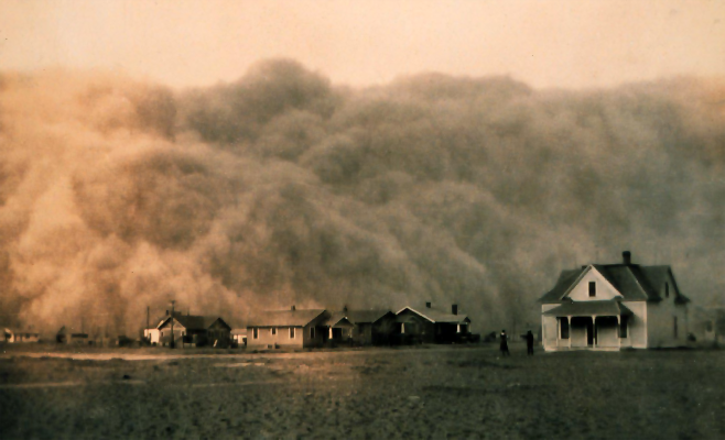 A dust storm approaching Stratford, Texas. Houses in foreground and dust storm in background, 1935.